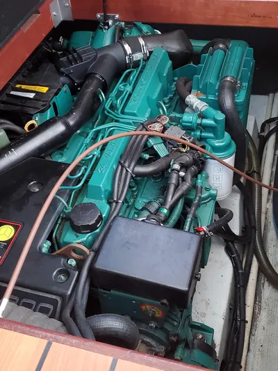 My Three Girls Yacht Photos Pics Engine compartment of a 2004 Lagoon 43 PC boat, showcasing detailed machinery.