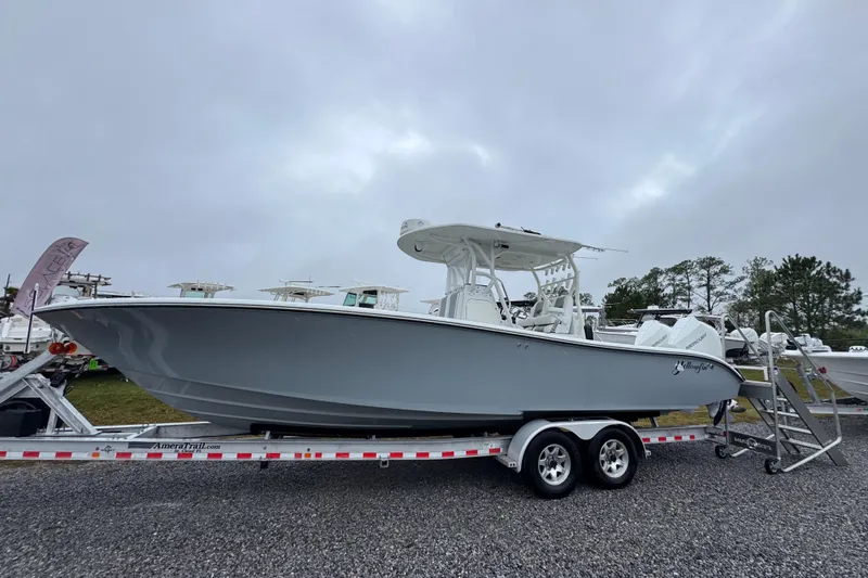  Yacht Photos Pics 2007 Yellowfin 31 Center Console boat on trailer, overcast sky background.