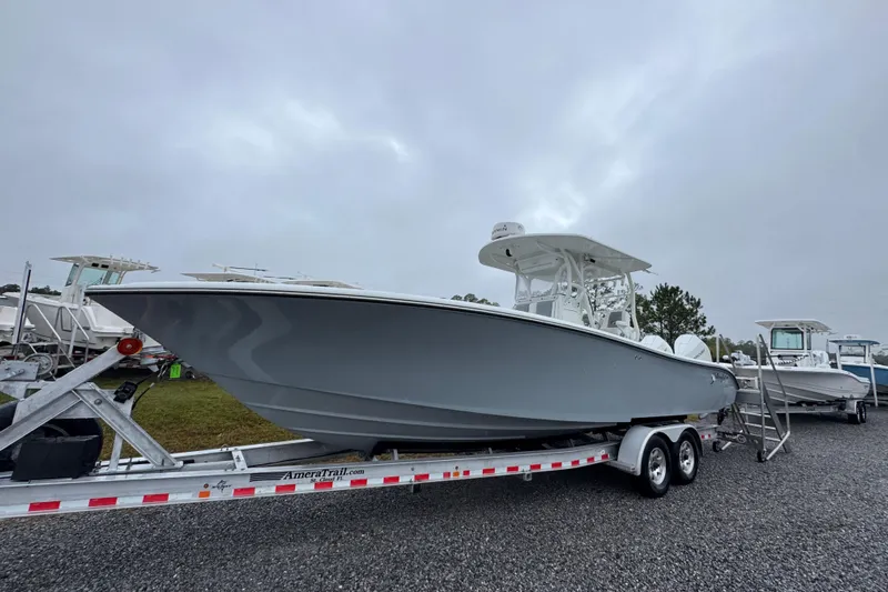  Yacht Photos Pics 2007 Yellowfin 31 Center Console boat on trailer under cloudy sky.
