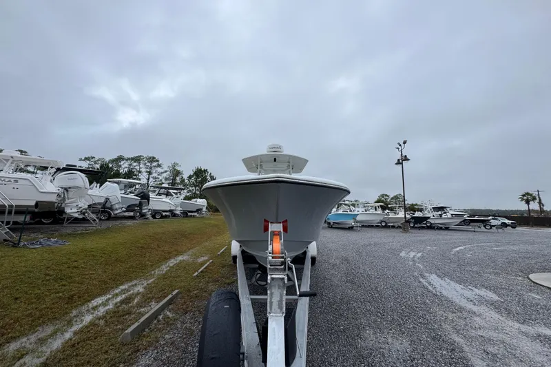  Yacht Photos Pics 2007 Yellowfin 31 Center Console boat on trailer in a marina.