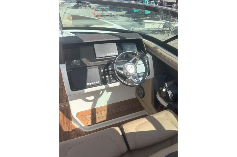  Yacht Photos Pics Helm of 2016 Sea Ray 350 SLX with Raymarine electronics and leather seating.