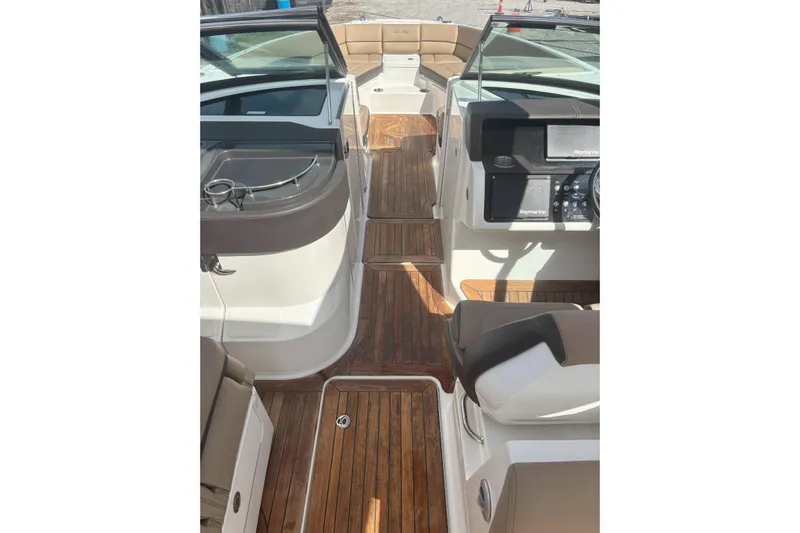  Yacht Photos Pics 2016 Sea Ray 350 SLX boat interior with wood flooring and modern dashboard.