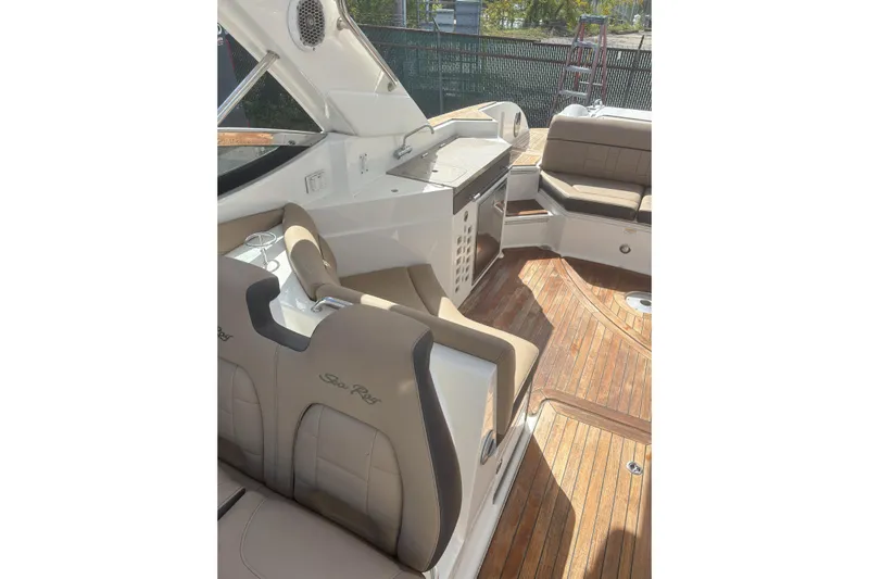  Yacht Photos Pics Interior of 2016 Sea Ray 350 SLX boat with luxurious seating and wooden flooring.