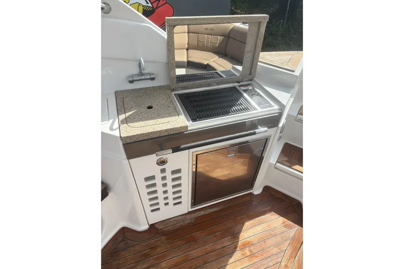  Yacht Photos Pics Outdoor kitchen on 2016 Sea Ray 350 SLX boat with grill and sink.