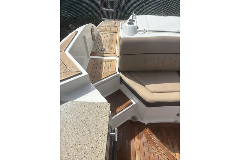  Yacht Photos Pics 2016 Sea Ray 350 SLX boat interior with teak flooring and beige seating.