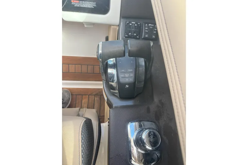  Yacht Photos Pics Control panel of a 2016 Sea Ray 350 SLX boat, featuring throttle and joystick.