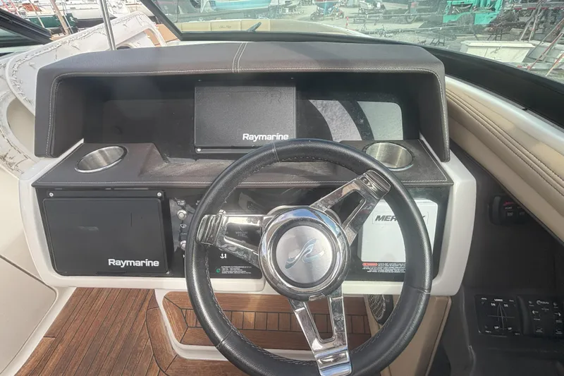  Yacht Photos Pics Steering wheel and dashboard of 2016 Sea Ray 350 SLX boat with Raymarine electronics.