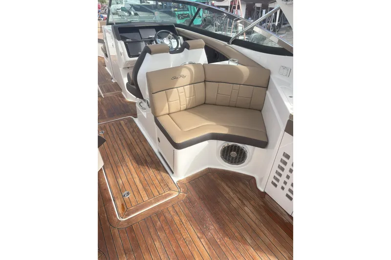  Yacht Photos Pics 2016 Sea Ray 350 SLX boat interior with tan seating and wooden flooring.