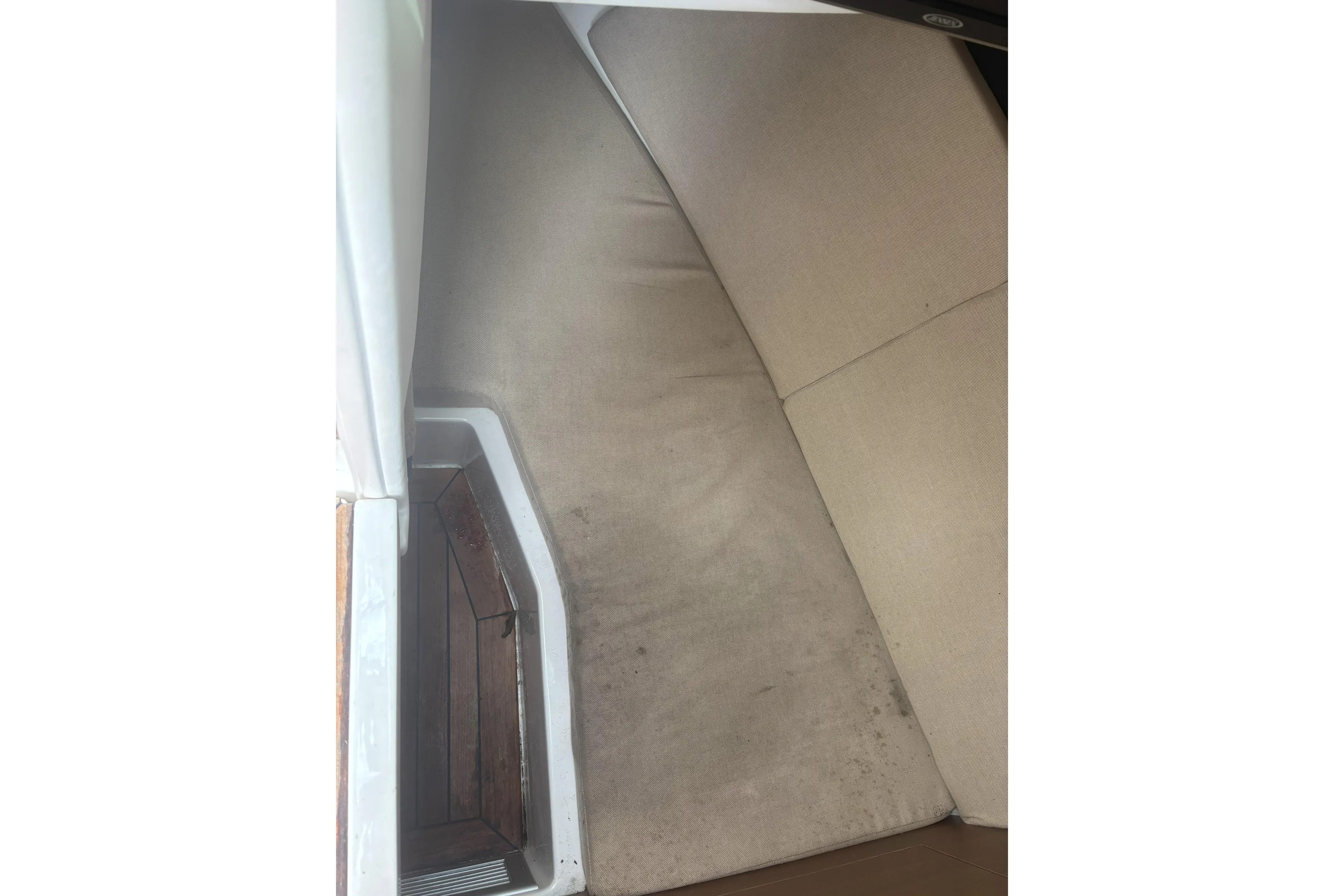  Yacht Photos Pics Interior seating area of a 2016 Sea Ray 350 SLX boat with beige cushions.