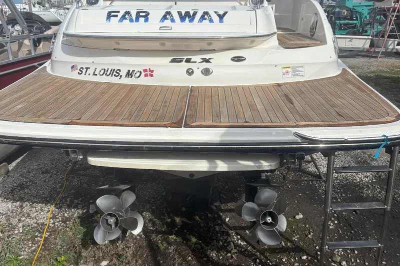  Yacht Photos Pics Rear view of 2016 Sea Ray 350 SLX boat with wooden deck, docked in St. Louis, MO.