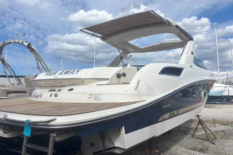  Yacht Photos Pics 2016 Sea Ray 350 SLX boat on display under a cloudy sky.