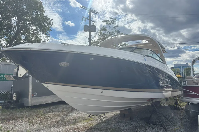  Yacht Photos Pics 2016 Sea Ray 350 SLX boat on display under a cloudy sky.