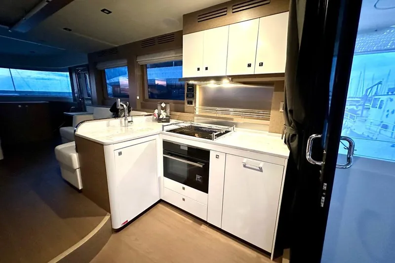  Yacht Photos Pics Luxurious 2024 Sirena 58 Fly yacht interior kitchen with modern appliances and elegant design.