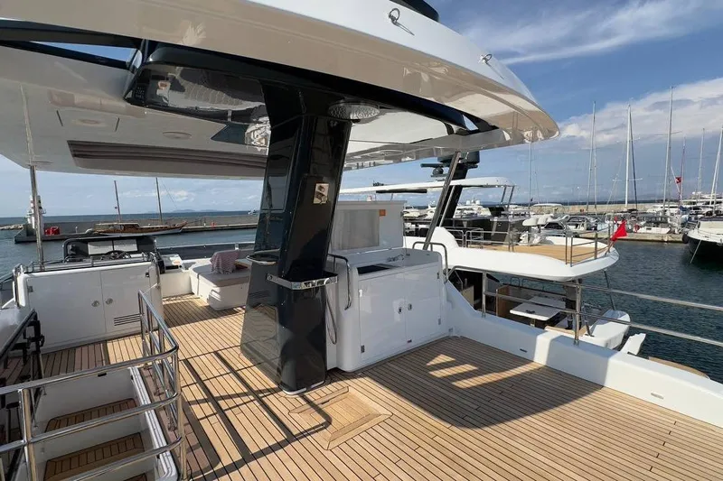  Yacht Photos Pics Luxurious 2024 Sirena 58 Fly yacht with spacious deck and modern amenities at marina.