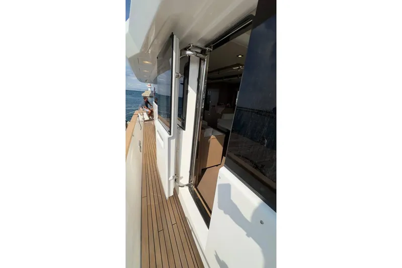  Yacht Photos Pics 2024 Sirena 58 Fly yacht deck with open door, ocean view.