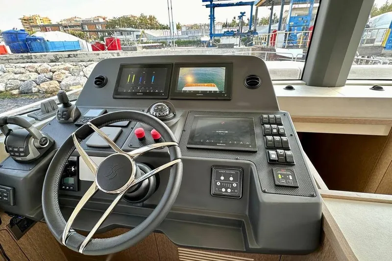  Yacht Photos Pics 2024 Sirena 58 Fly yacht helm with advanced navigation displays and controls.