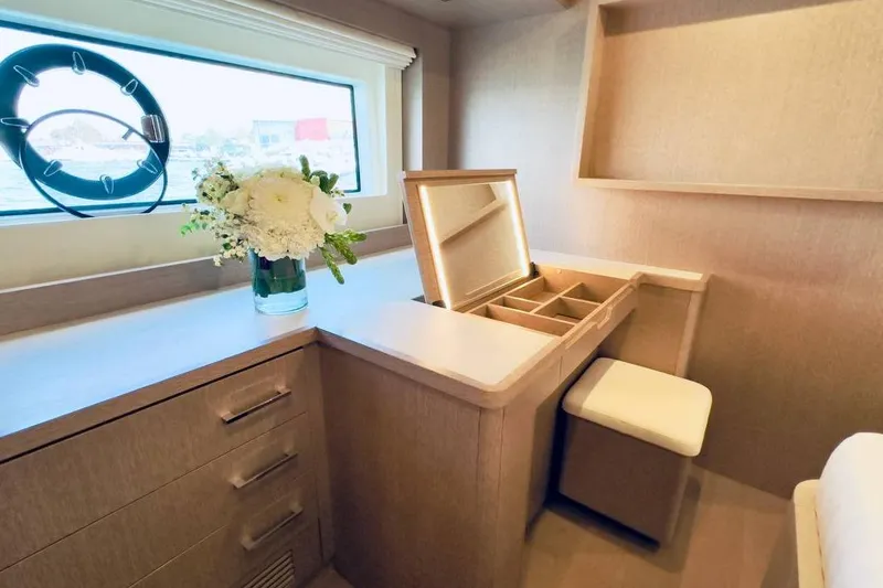  Yacht Photos Pics Luxurious interior of 2024 Sirena 58 Fly yacht with vanity and floral arrangement.