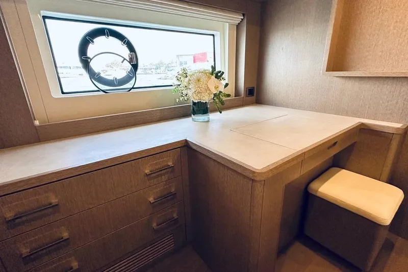  Yacht Photos Pics Luxurious interior of 2024 Sirena 58 Fly yacht with elegant desk and window view.