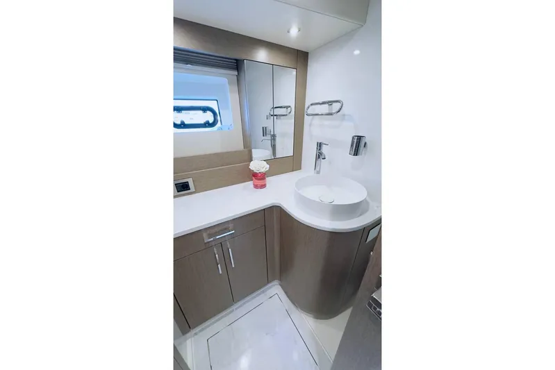  Yacht Photos Pics Luxurious bathroom in 2024 Sirena 58 Fly yacht with modern fixtures and elegant design.