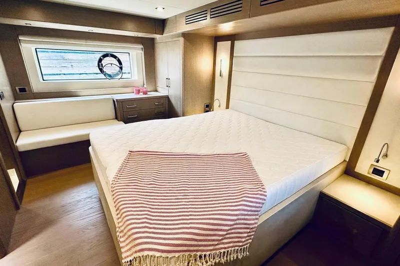  Yacht Photos Pics Luxurious 2024 Sirena 58 Fly yacht bedroom with elegant design and cozy furnishings.