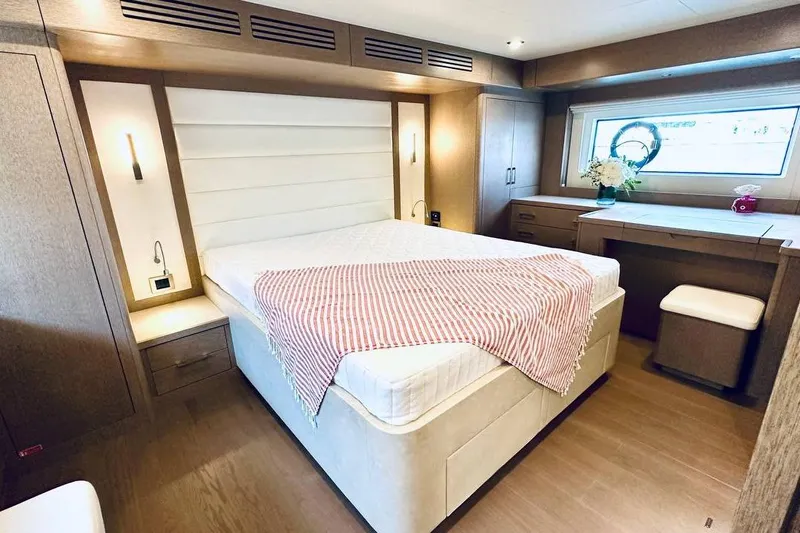  Yacht Photos Pics Luxurious 2024 Sirena 58 Fly yacht bedroom with modern decor and elegant furnishings.
