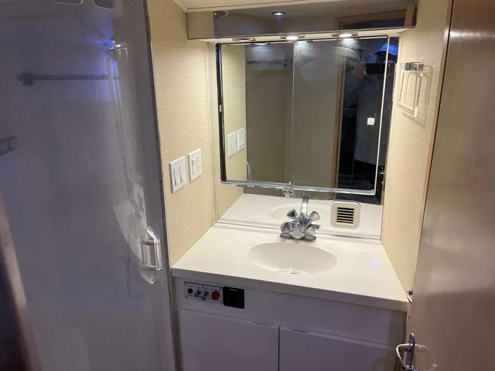 Amen Corner Yacht Photos Pics Bathroom vanity in 1995 Hatteras 45 Convertible yacht with mirror and sink.