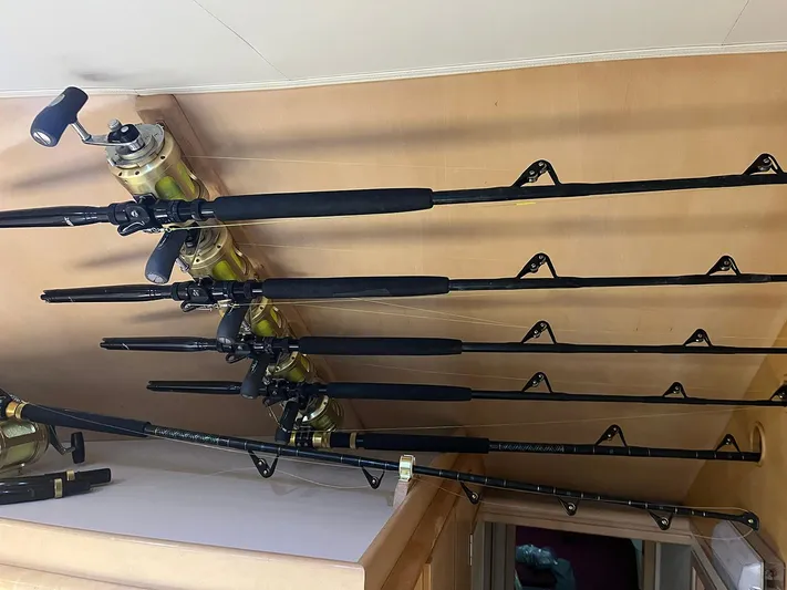 Amen Corner Yacht Photos Pics Fishing rods stored on a 1996 Hatteras 43 Convertible boat interior.
