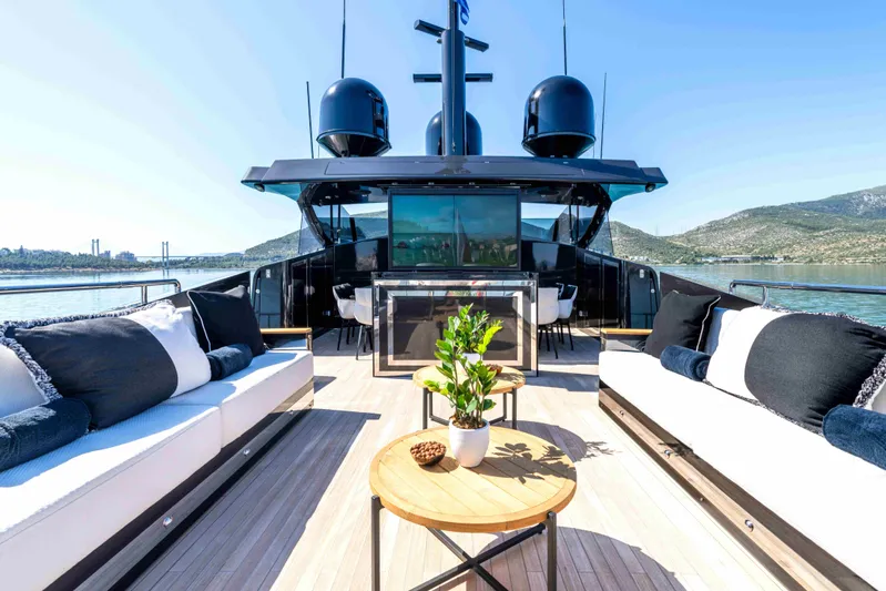 Aquila Yacht Photos Pics Luxurious 2004 Baglietto Custom yacht deck with elegant seating and scenic views.