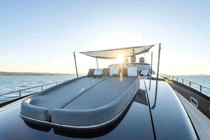 Aquila Yacht Photos Pics Luxurious 2004 Baglietto Custom yacht with sun deck, ocean view, and sunset backdrop.