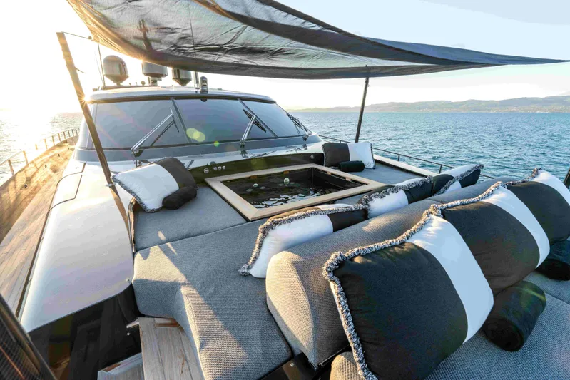 Aquila Yacht Photos Pics Luxurious 2004 Baglietto Custom yacht deck with plush seating and ocean view.