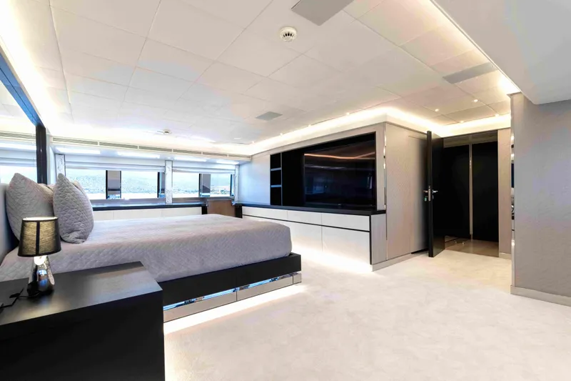 Aquila Yacht Photos Pics Luxurious bedroom interior on 2004 Baglietto Custom yacht, featuring modern design and large windows.