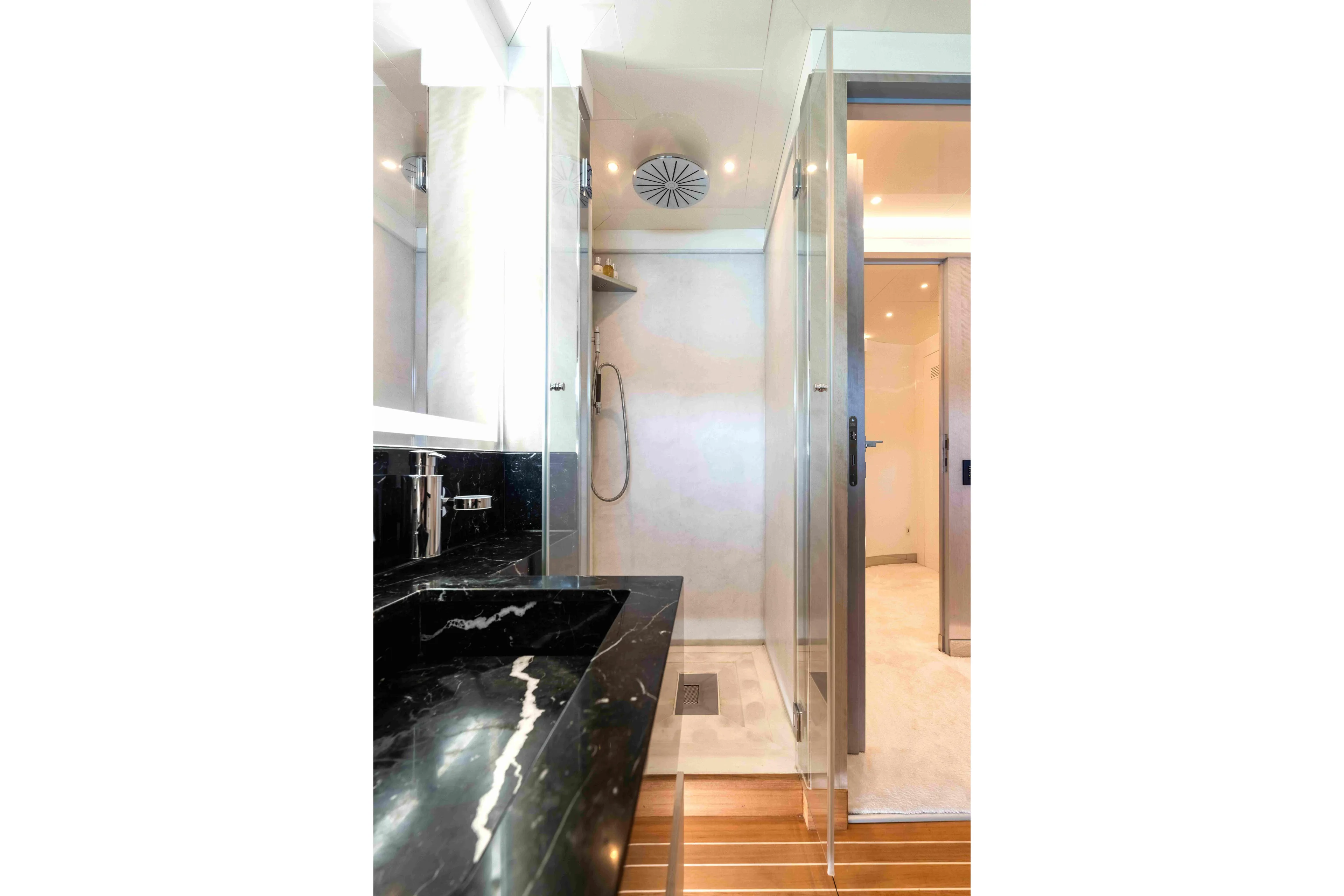 Aquila Yacht Photos Pics Luxurious yacht bathroom with marble sink, glass shower, and modern fixtures, Baglietto Custom 2004.