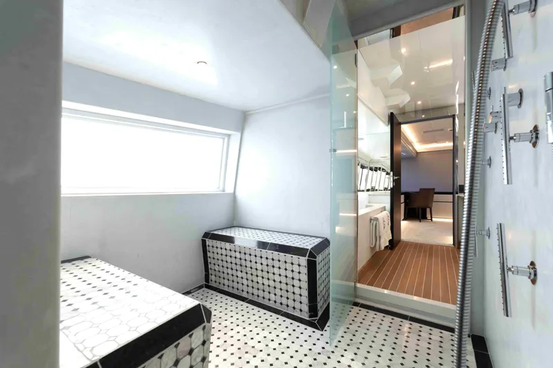 Aquila Yacht Photos Pics Luxurious bathroom on 2004 Baglietto Custom yacht with modern design and elegant fixtures.