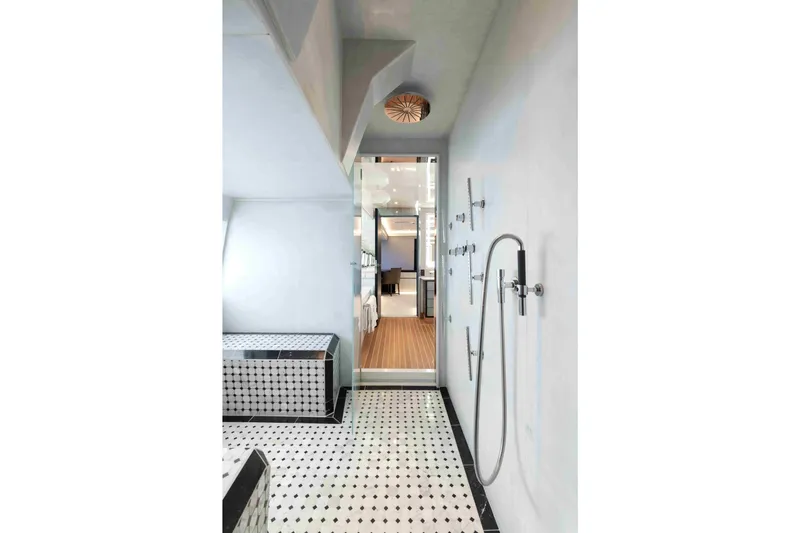 Aquila Yacht Photos Pics Luxurious yacht bathroom with modern shower, elegant black-and-white tiles, Baglietto Custom 2004.