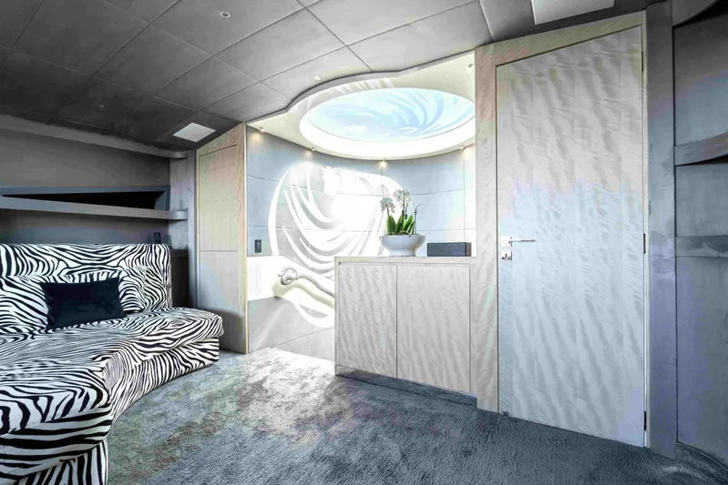 Aquila Yacht Photos Pics Luxurious 2004 Baglietto Custom yacht interior with zebra-patterned seating and modern decor.