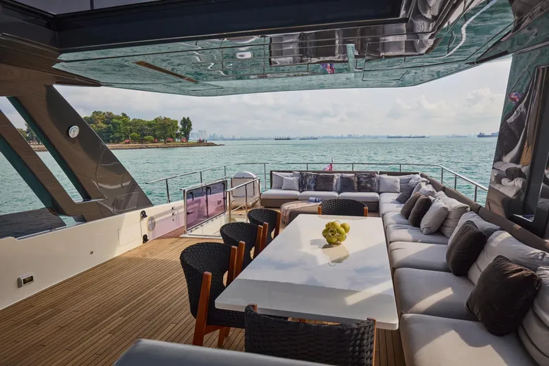  Yacht Photos Pics Luxurious 2018 Ferretti Yachts 850 deck with elegant seating and ocean view.