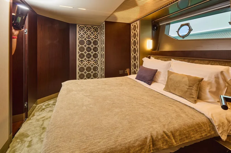  Yacht Photos Pics Luxurious bedroom interior of 2018 Ferretti Yachts 850 with elegant decor and plush bedding.