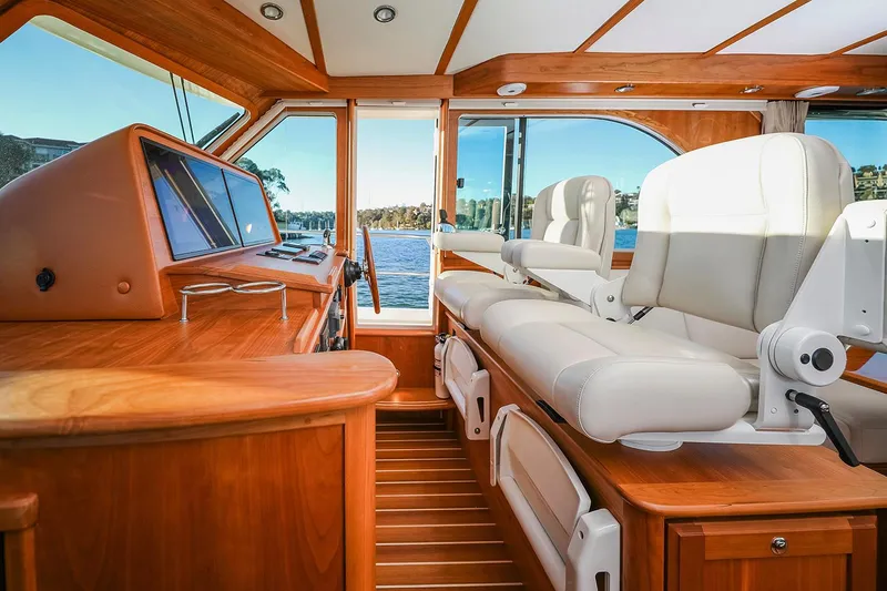  Yacht Photos Pics 2025 Sabre 45 Salon Express interior with luxurious seating and wooden finishes.