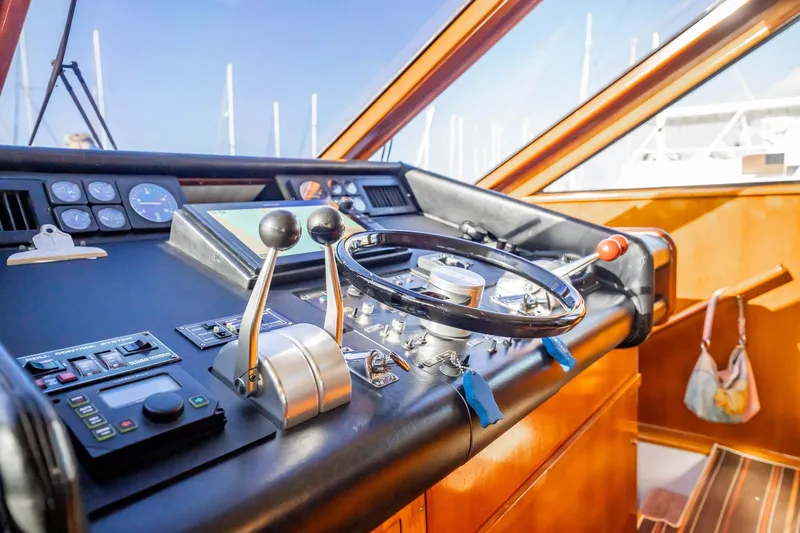 Jubilee Yacht Photos Pics Cockpit of 1989 Viking 63 Motor Yacht with steering wheel and control panel.