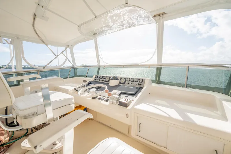 Jubilee Yacht Photos Pics Helm of 1989 Viking 63 Motor Yacht with ocean view and navigational controls.