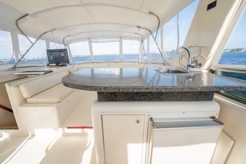 Jubilee Yacht Photos Pics Interior of 1989 Viking 63 Motor Yacht with granite countertop and ocean view.