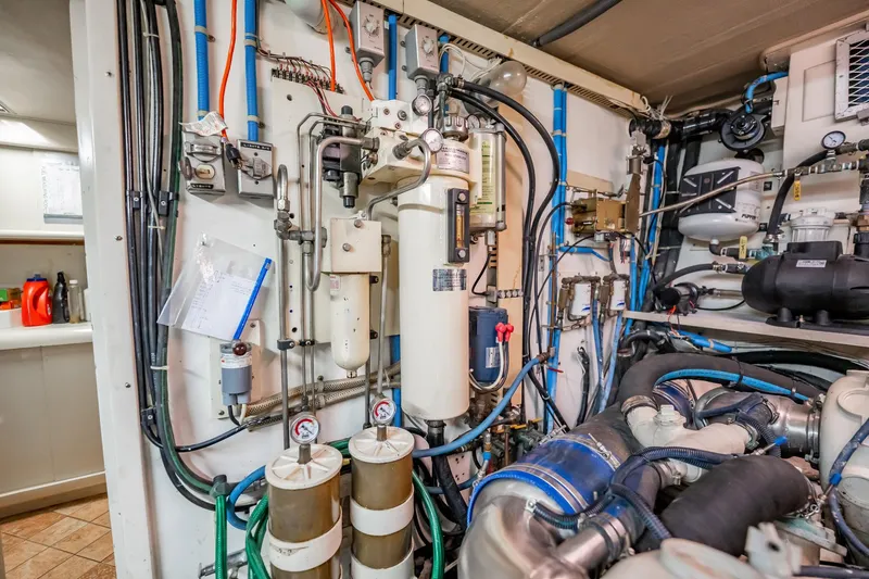 Jubilee Yacht Photos Pics Engine room of 1989 Viking 63 Motor Yacht with complex machinery and piping.