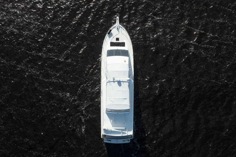 Jubilee Yacht Photos Pics Aerial view of 1989 Viking 63 Motor Yacht on dark water.