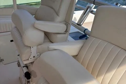  Yacht Photos Pics 2011 Grady-White Canyon 306 boat seats with white upholstery and armrests.