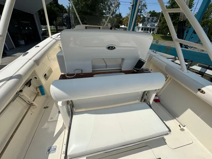  Yacht Photos Pics 2014 Pursuit S 280 Sport boat interior with seating and storage.