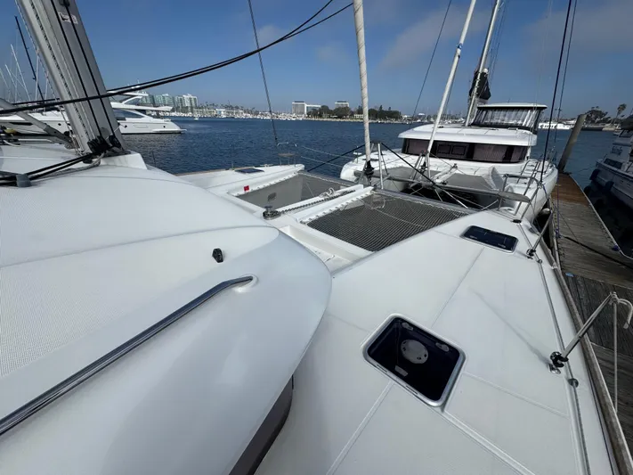 La Vigie Yacht Photos Pics 2018 Lagoon 450 F catamaran docked at marina, featuring spacious deck and modern design.