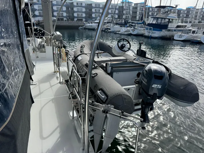 La Vigie Yacht Photos Pics 2018 Lagoon 450 F yacht with dinghy and outboard motor in marina setting.