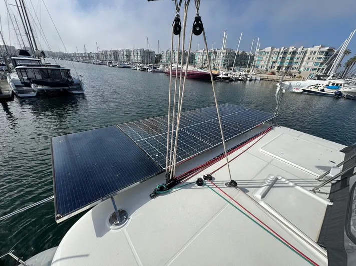 La Vigie Yacht Photos Pics 2018 Lagoon 450 F catamaran with solar panels docked in a marina.