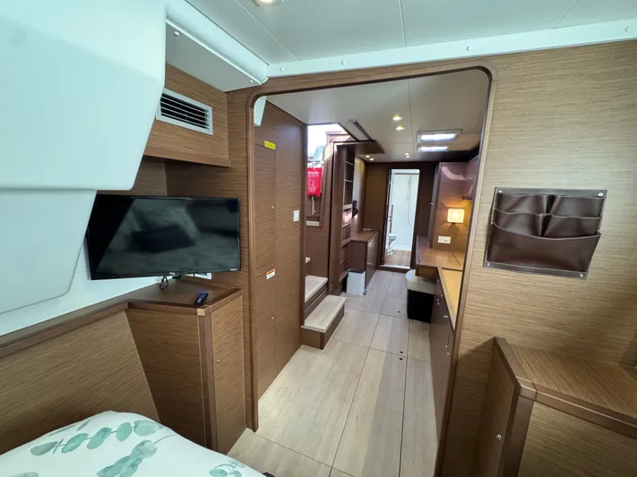 La Vigie Yacht Photos Pics Interior of 2018 Lagoon 450 F catamaran with modern wood finish and TV.