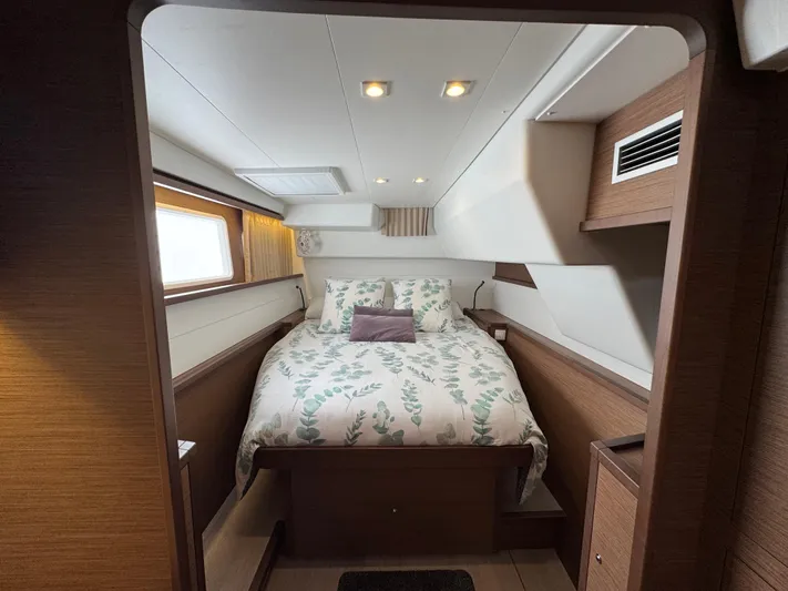 La Vigie Yacht Photos Pics Luxurious cabin interior of 2018 Lagoon 450 F catamaran with cozy bedding.